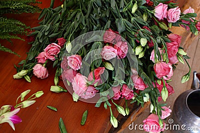 Flower cuttings being prepared to be arranged to make a bouquet.