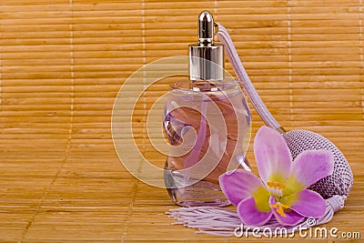 Flower and glass perfume bottle