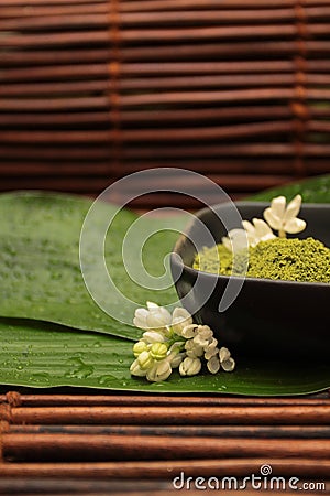 Flowers on the background of spa mud green leaf