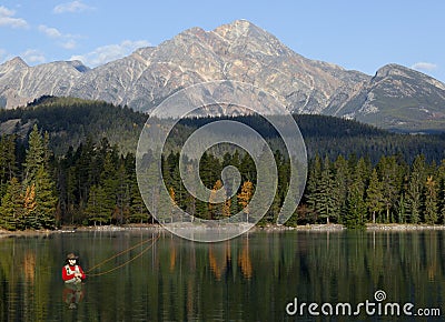 Fly Fishing In Rocky Mountains, Alberta, Canada