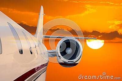 Flying Private Jet Airplane with Sunset background