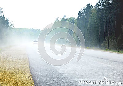 THE FOGGY ROAD WITH CAR