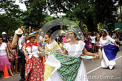 Folk dancers on carnival street.