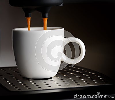Coffee machine pouring a cup of espresso