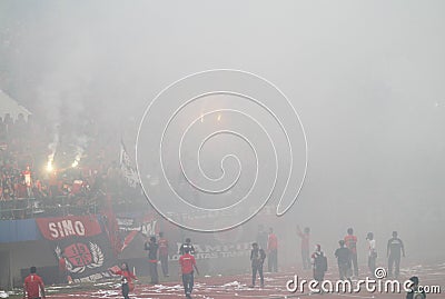 Football match stopped because of smoke from fireworks