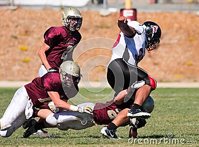 Football Player Being Tackled During a Game