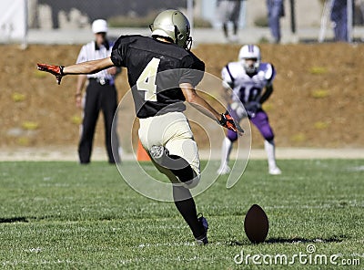 Football Player Kicking a Ball