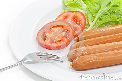 Fork in sausage plate
