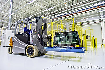 Forklift loader in large modern warehouse