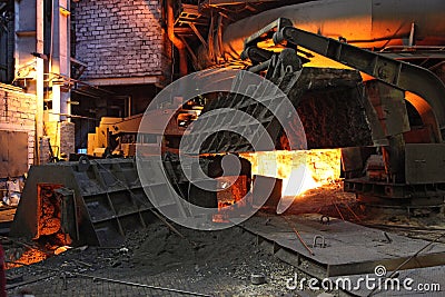 Foundry with red hot melting pig iron in Russia