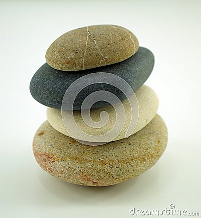 Four different zen stones on white