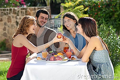 Happy friends enjoying a healthy meal