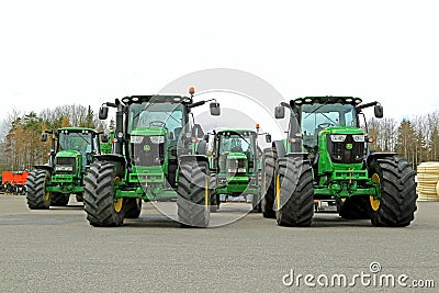 Four John Deere Agricultural Tractors on a Yard