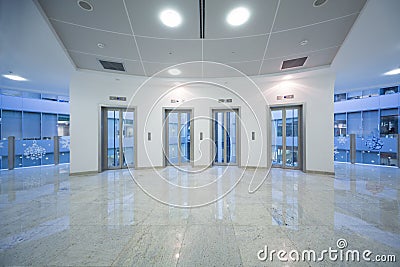 Four transparent elevator door in the business building