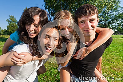 Four young people having fun in the park