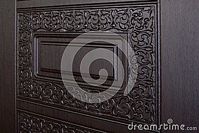 Fragment beautiful carved brown wooden door
