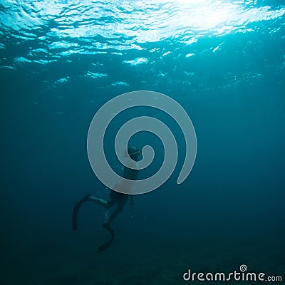 Free diver coming to surface