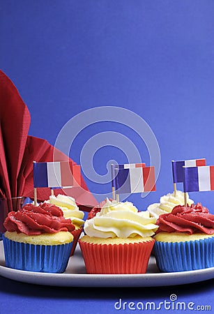 French theme red, white and blue mini cupcake cakes with flags of France - vertical.