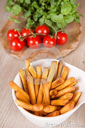 Fresh baked pizza bread sticks with bunch of tomato