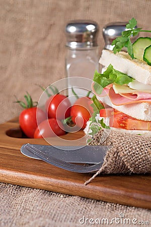 Fresh club sandwich in rustic kitchen setting