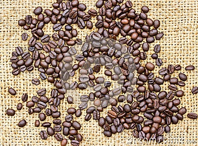 Fresh coffee beans on wood background