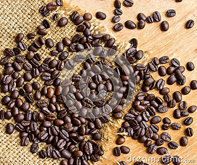 Fresh coffee beans on wood