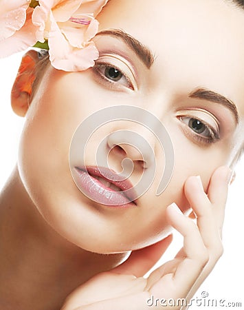 Fresh face with gladiolus flowers in her hands
