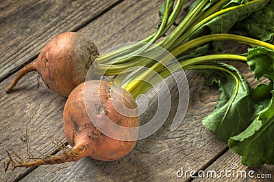 Fresh golden beetroot on a timber table