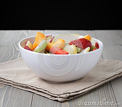Fresh mix fruit salad with strawberry, kiwi and peach