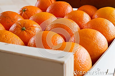 Fresh Oranges in a wooden box