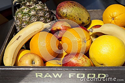 Fresh organic fruit in wooden box