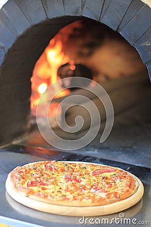 Pizza in a wooden oven