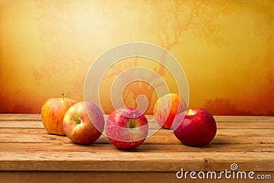 Fresh red apples over autumn background