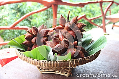 Fresh Salak snake fruit in basket.