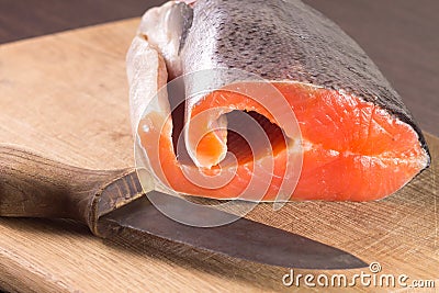 Fresh Salmon with knife on board