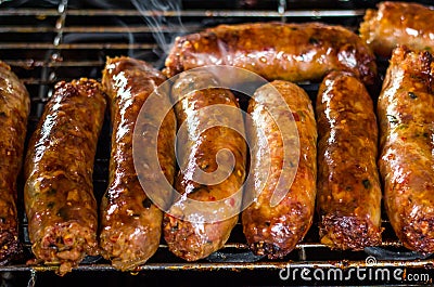 Fresh sausage and hot dogs grilling