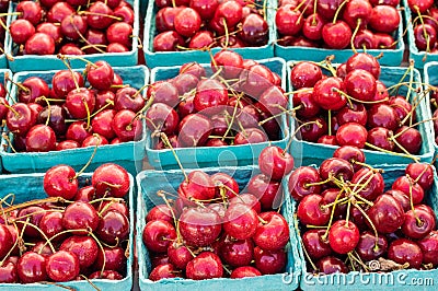 Fresh sweet red cherries in boxes