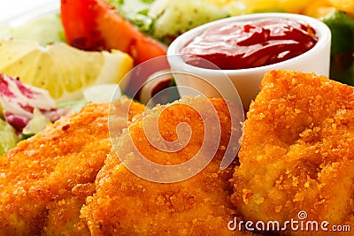 Fried chicken nuggets and vegetables