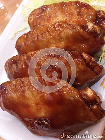 Fried chicken wing with teriyaki sauce