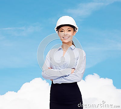 Friendly smiling businesswoman in white helmet