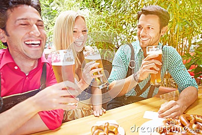 Friends laughing in beer garden
