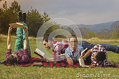 Friends outdoors with book