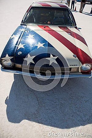 Front side of an American Hot Rod with American flag painted on