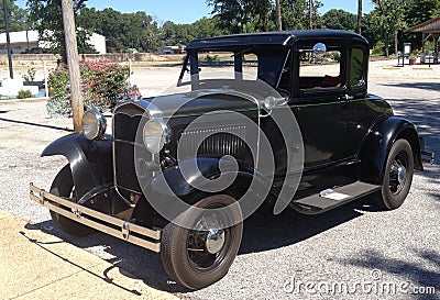 Front View of black 1940 s Ford antique car.