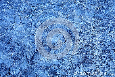 Frost patterns on window glass in winter