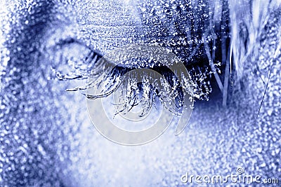 Frozen woman s eye covered in frost