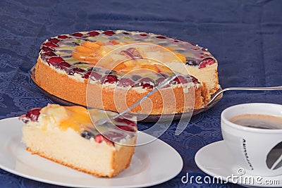 Fruit cake with coffee and cake plate
