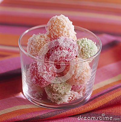 Fruit paste truffles coated in grated coconut