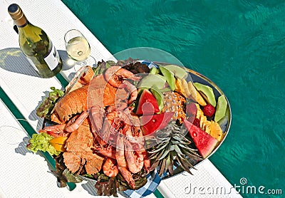 Fruit and seafood platter with wine