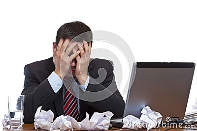 Frustrated desperated man sitting at desk